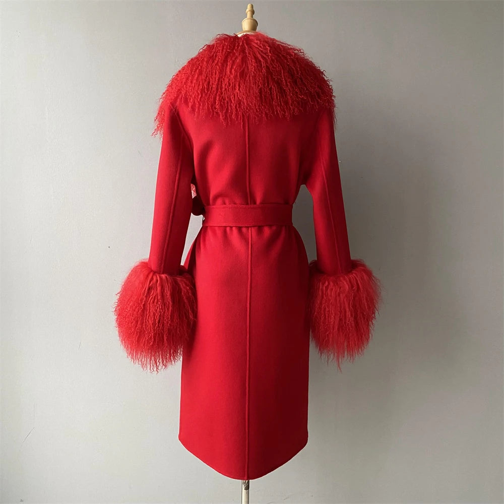 Red coat with feathered cuffs and collar on a mannequin against a plain background