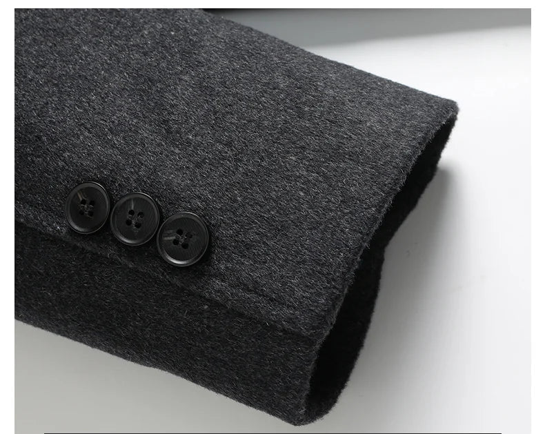 Dark gray fabric with three black buttons on a light gray background