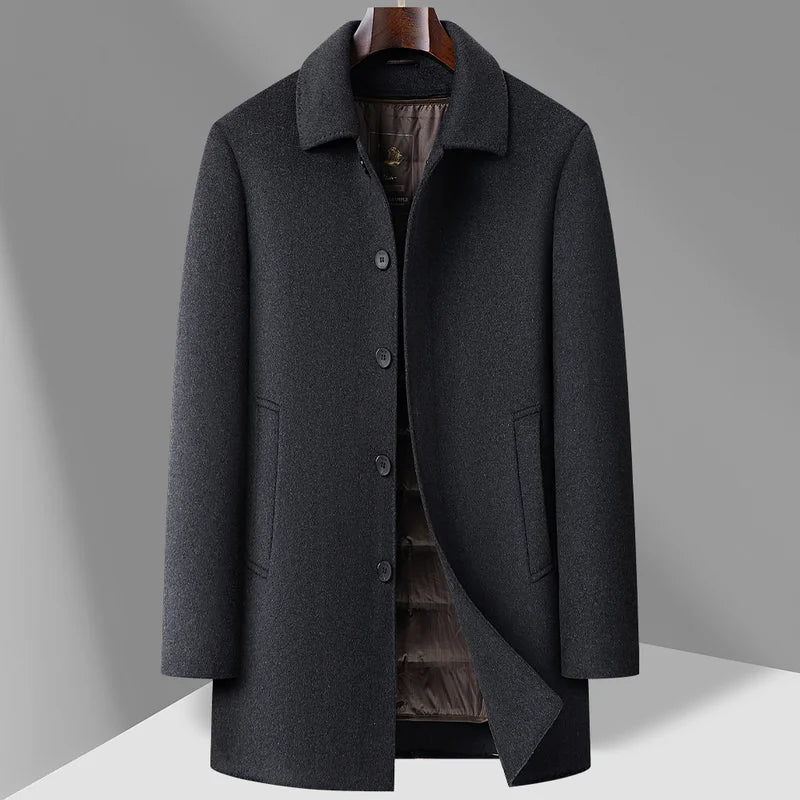 Gray overcoat on a hanger against a gray background