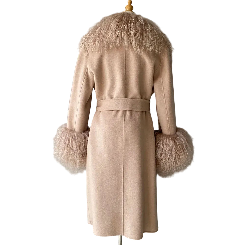 Beige coat with fur cuffs and collar on a mannequin against a gray background