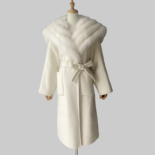 White coat with fur collar on a mannequin against a gray background