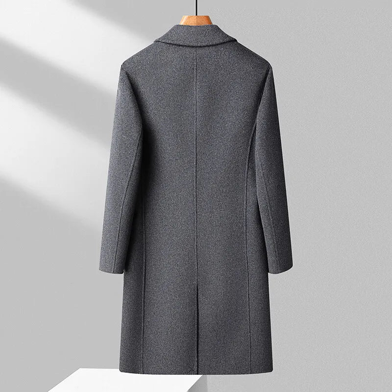 Gray coat on a mannequin against a light gray background
