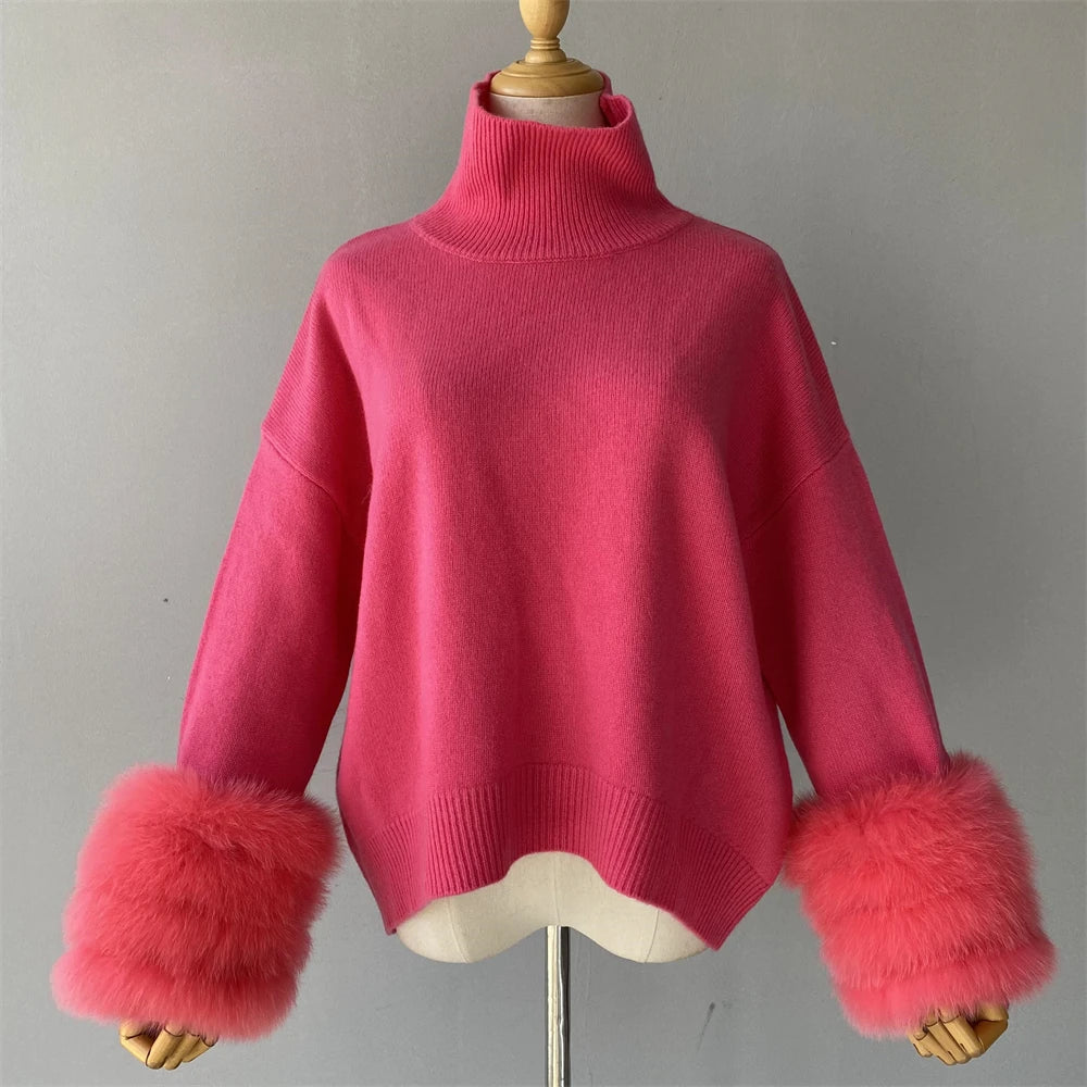 Pink sweater with fur cuffs on a mannequin against a gray background