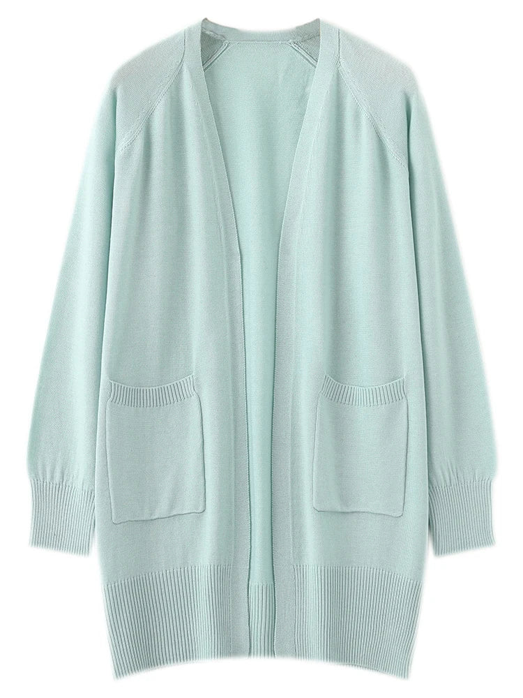 Light blue cardigan with pockets on a white background