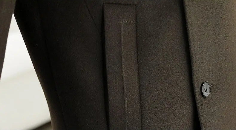 Close-up of a brown coat with a button on a light background