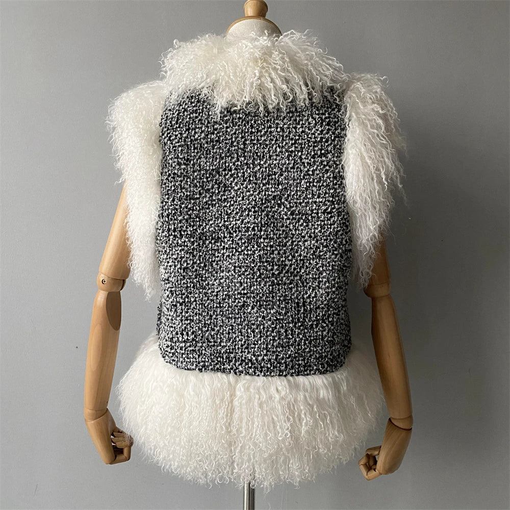 Textured vest with white fringes on a mannequin against a gray background