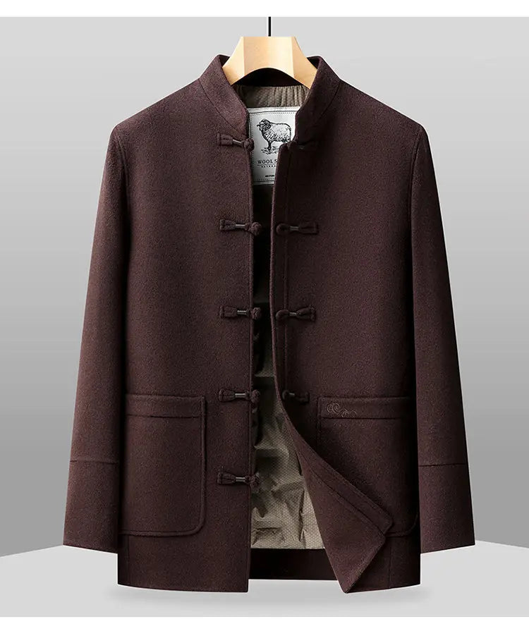 Brown coat on a hanger against a gray background
