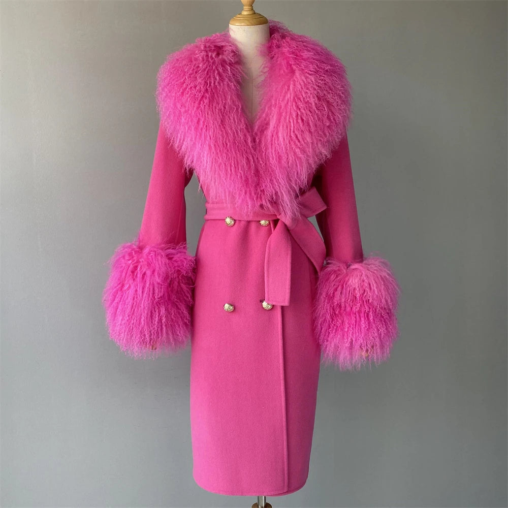 Pink coat with feathered cuffs and collar on a mannequin against a gray background