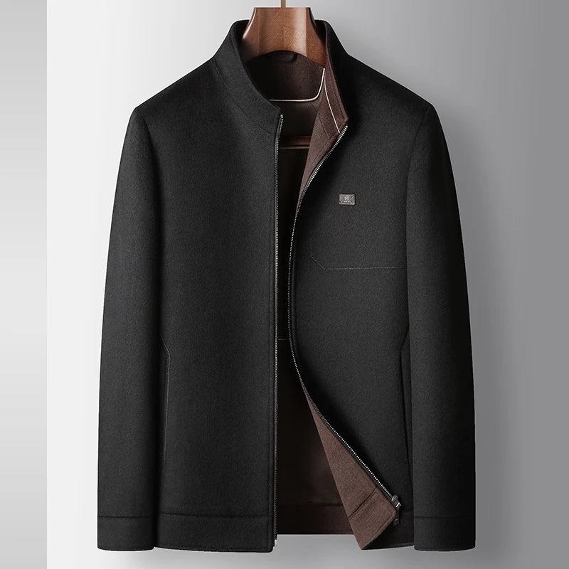 Dark gray coat with brown lining on a hanger against a light gray background