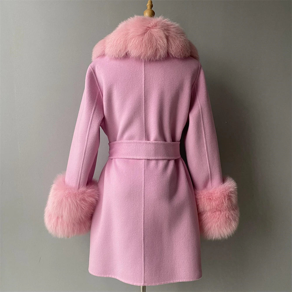 Pink coat with fur trim on a gray background