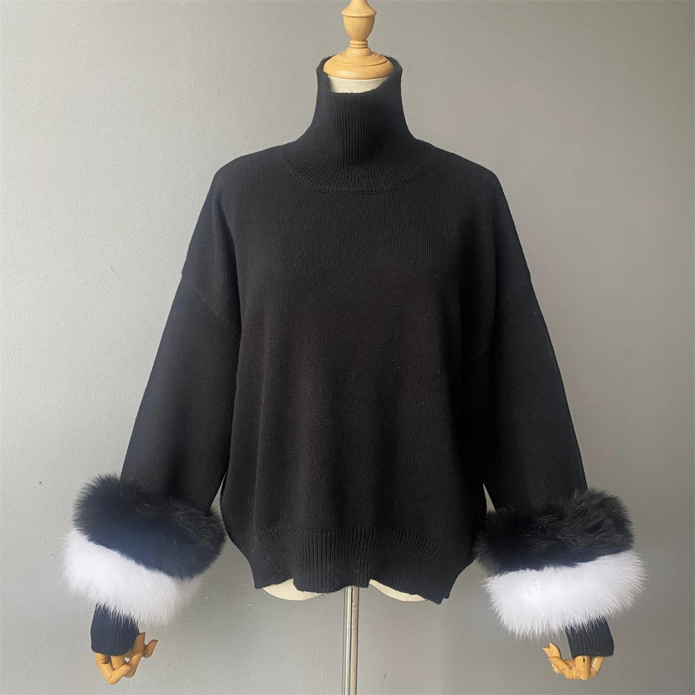 Black sweater with fur cuffs on a mannequin against a gray background