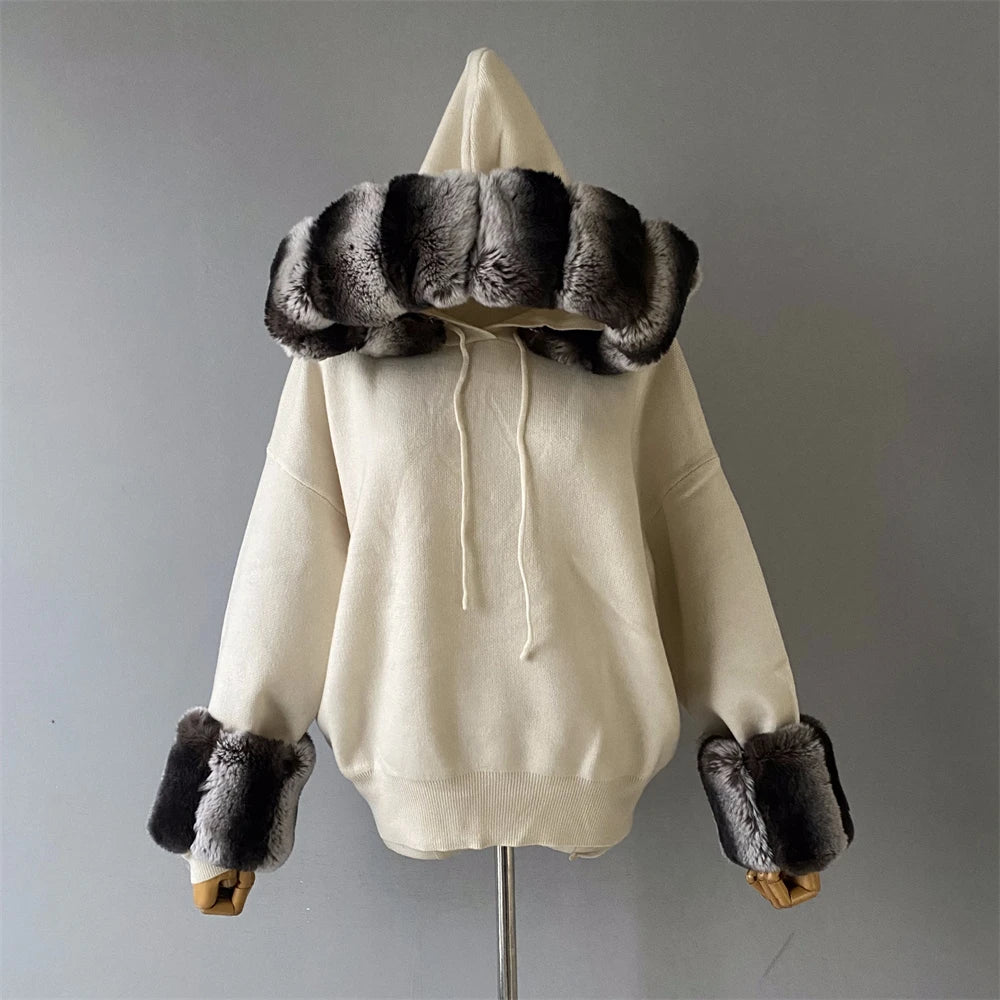 White hoodie with fur trim on a mannequin against a gray background