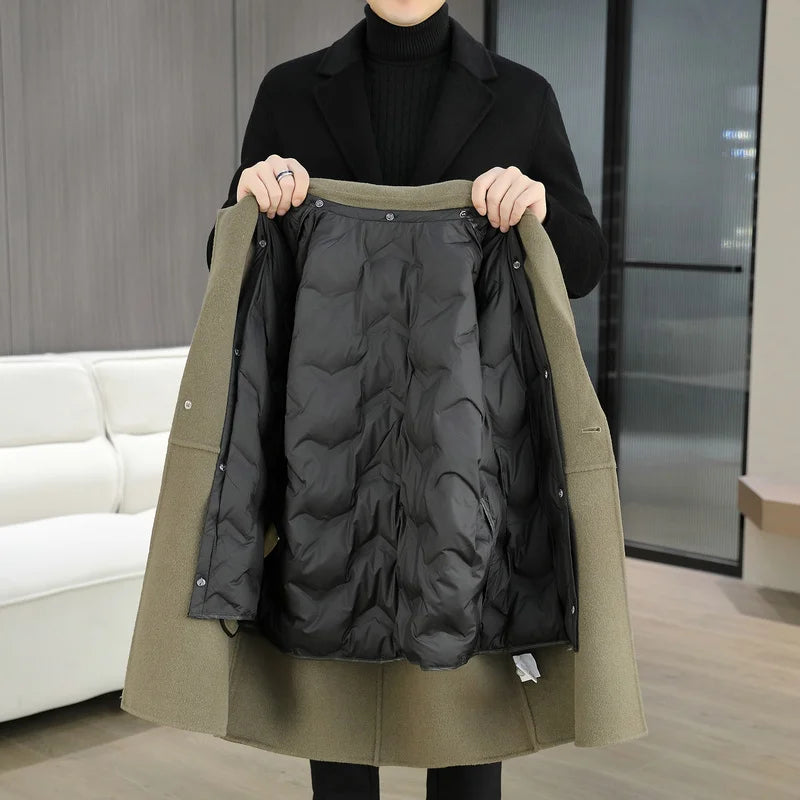 Person holding a green coat with a black quilted lining indoors.