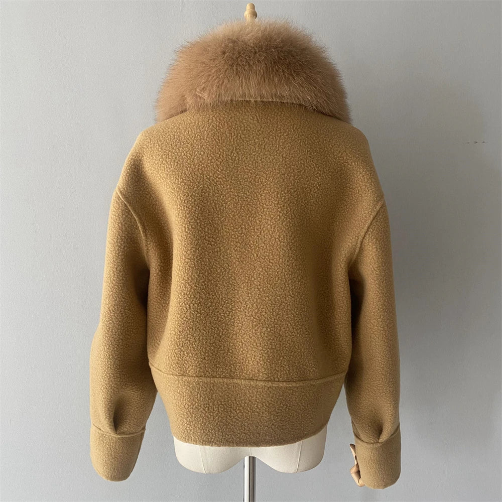 Brown jacket with fur collar on a mannequin against a plain background