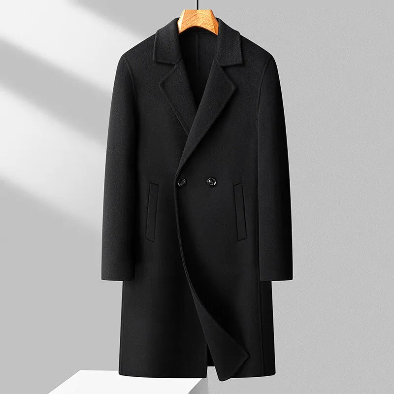 Black coat on a hanger against a light gray background