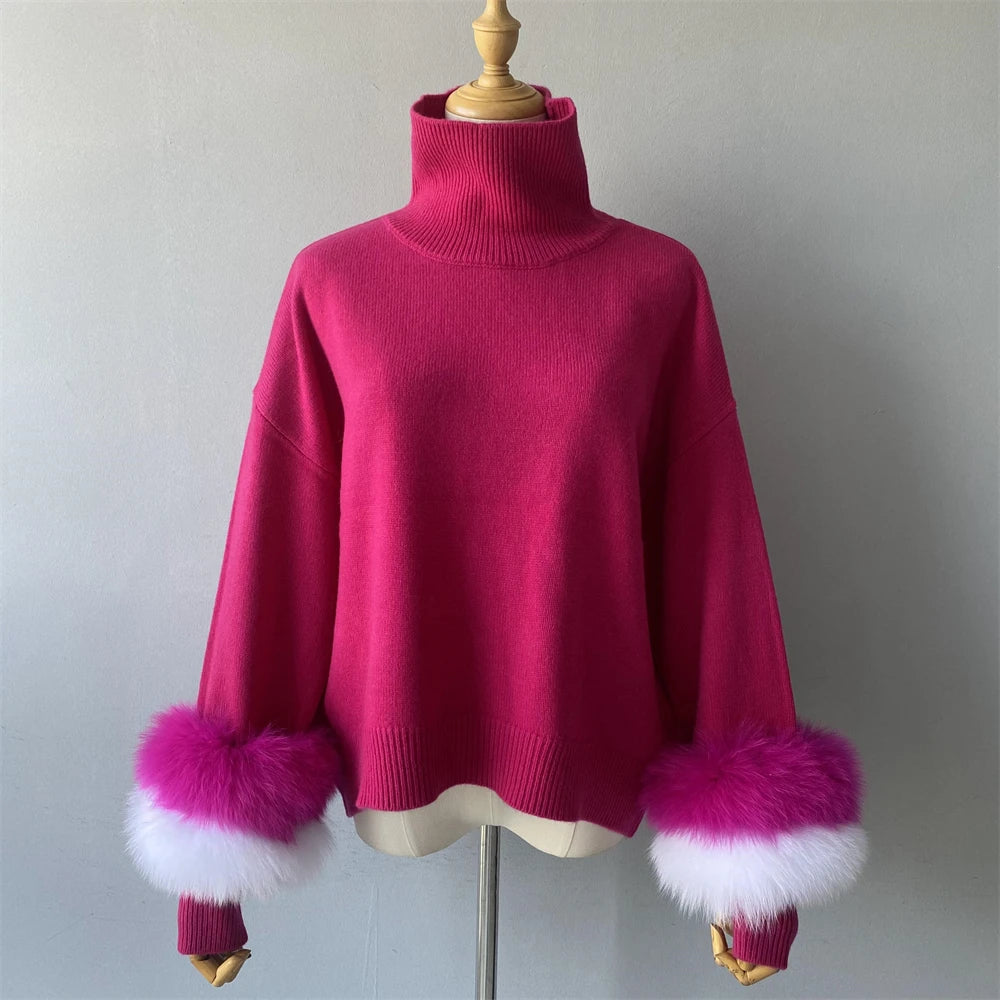 Pink sweater with fur cuffs on a mannequin against a plain background